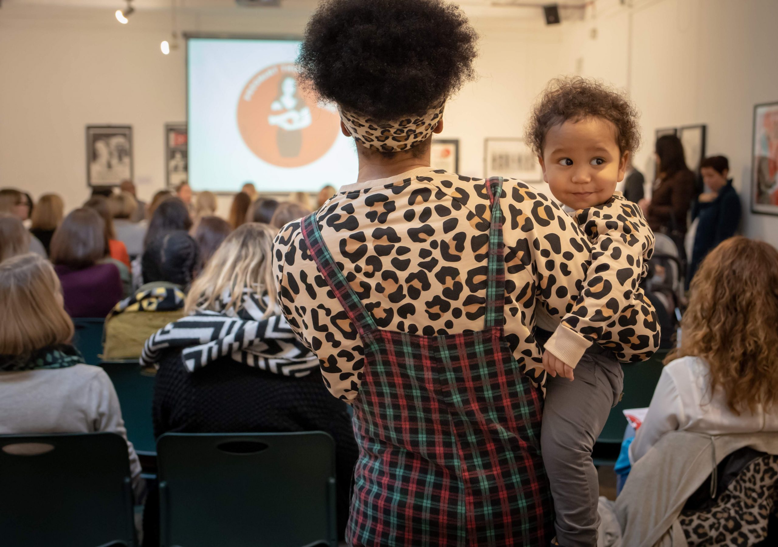 Mother and child at Pregnant then Screwed live. An event to raise awareness of maternity discrimination