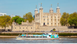 Terrible Thames Tour cruising by the Tower of London on a beautiful summer day