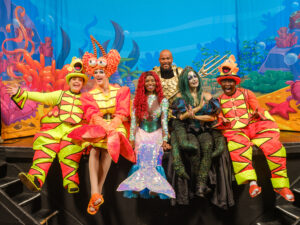 The colourful cast of Hoxton Hall’s brand new pantomime, The Little Mermaid all dressed up in their bright fishy costumes