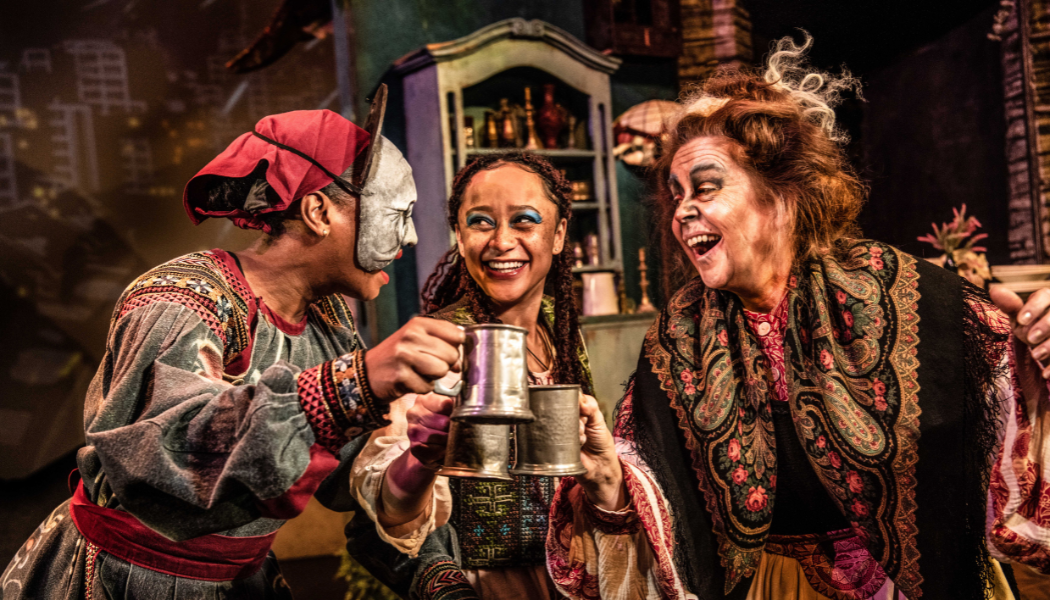 The House with Chicken Legs 3 female actors of multi ethnicities dressed in costume inspired by slavic folklore cheers and smile on stage