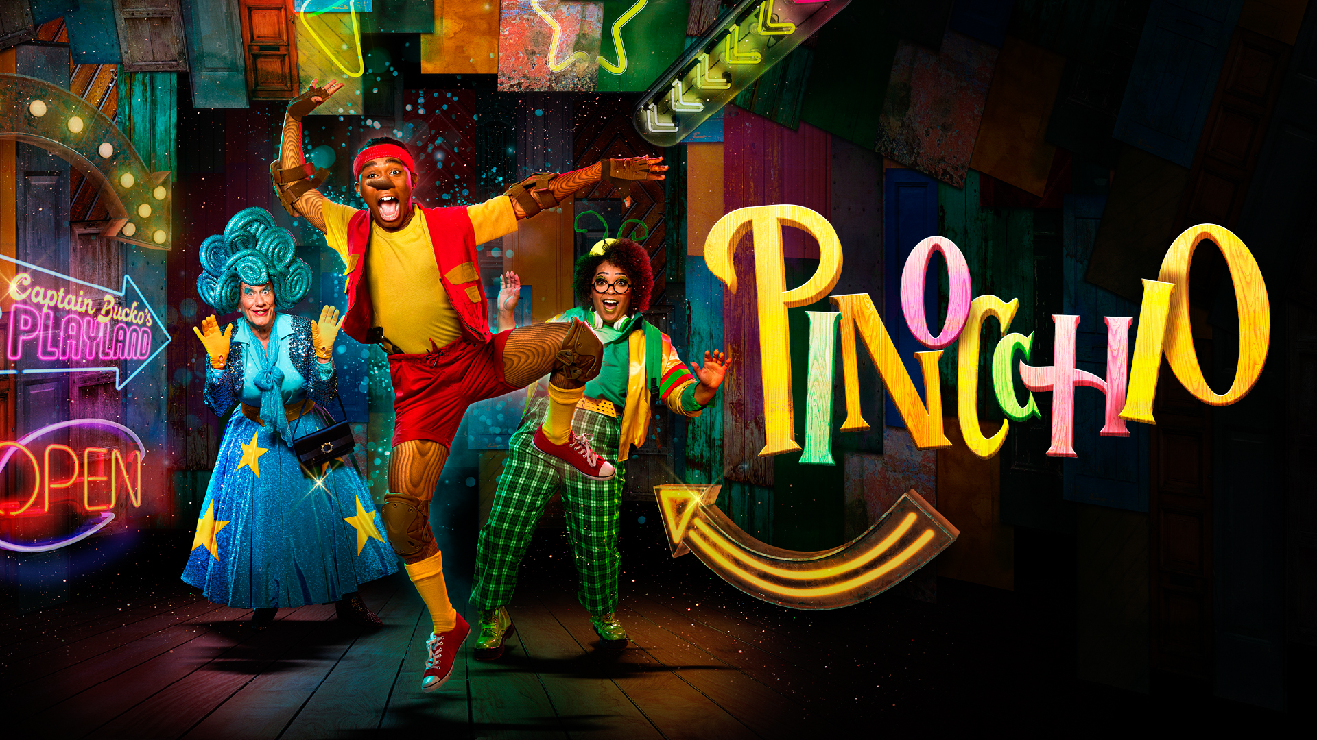 A vibrant promotional image for a London Pantomime production of Pinocchio at Theatre Royal. The cast is dressed in colorful, whimsical costumes, with Pinocchio in red shorts and bright yellow, accompanied by a lively character in a green checkered suit and a glamorous fairy godmother-like figure in a sparkly blue gown with stars. The neon-lit background gives off a playful, carnival-like atmosphere, with signs like 'Captain Bucco's Playland' and 'Open' in bright lights. The overall mood is fun, energetic, and festive, capturing the spirit of London’s beloved Panto tradition.