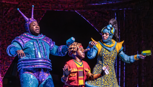 Colourful scene from Stratford East's 2024 production of Pinocchio, featuring vibrant costumes and engaging performances by the cast, bringing the classic tale to life for families in East London.