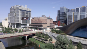 An aerial view of Sadler's Wells East, the new cultural hub for dance in Stratford's Queen Elizabeth Olympic Park, showcasing the modern architecture and its surrounding vibrant East Bank development.