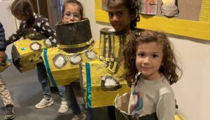 The Art Imaginarium Holiday camp in Hackney and Bethnal Green returns this October Half term. This photo is of some children getting stuck into paper mache yellow submarines