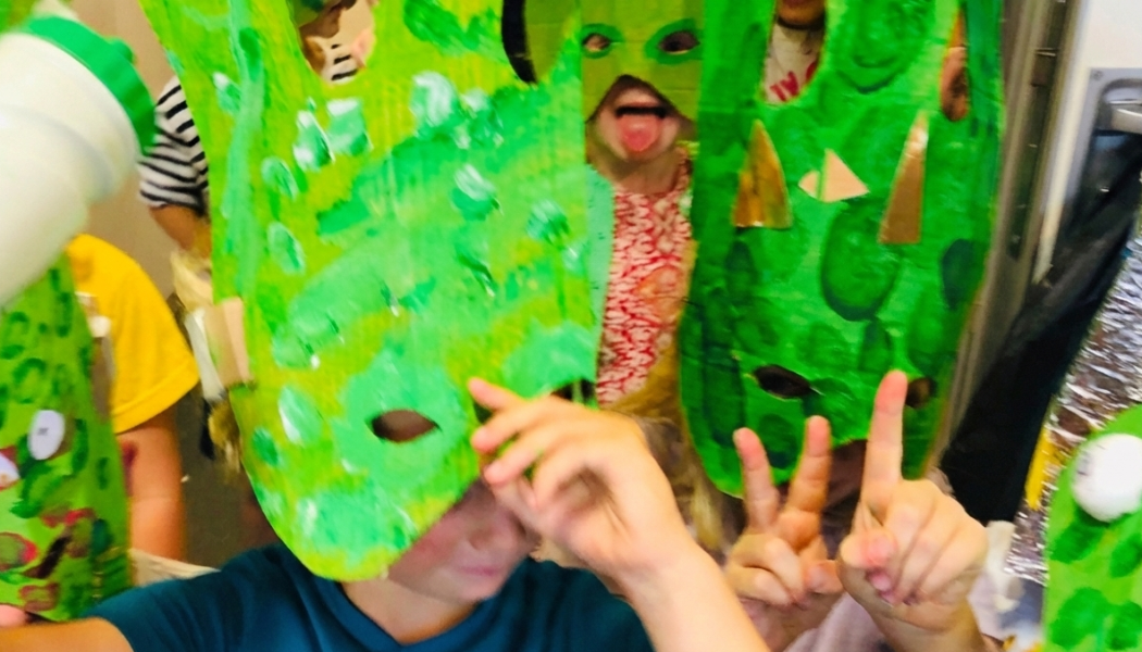 The Art Imaginarium is back for a fun and creative Half Term Camp in East London. This image is of a group of children wearing Green Alien masks they have made themselves from paper. The them for this February will be The Lost City of Atlantis
